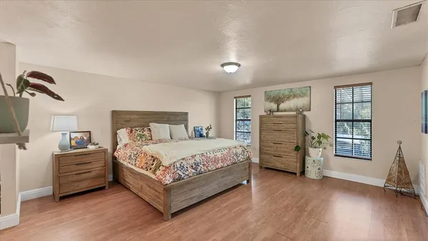 a bedroom with a bed and a closet