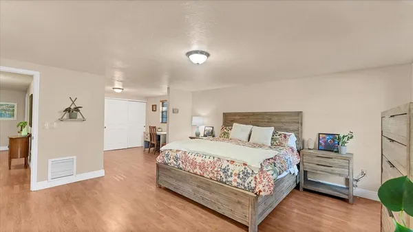 a bedroom with a bed and a table