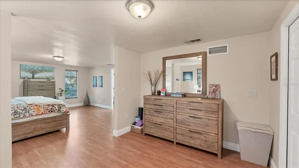a view of room with wooden floor