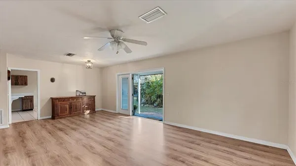 an empty room with furniture and a window