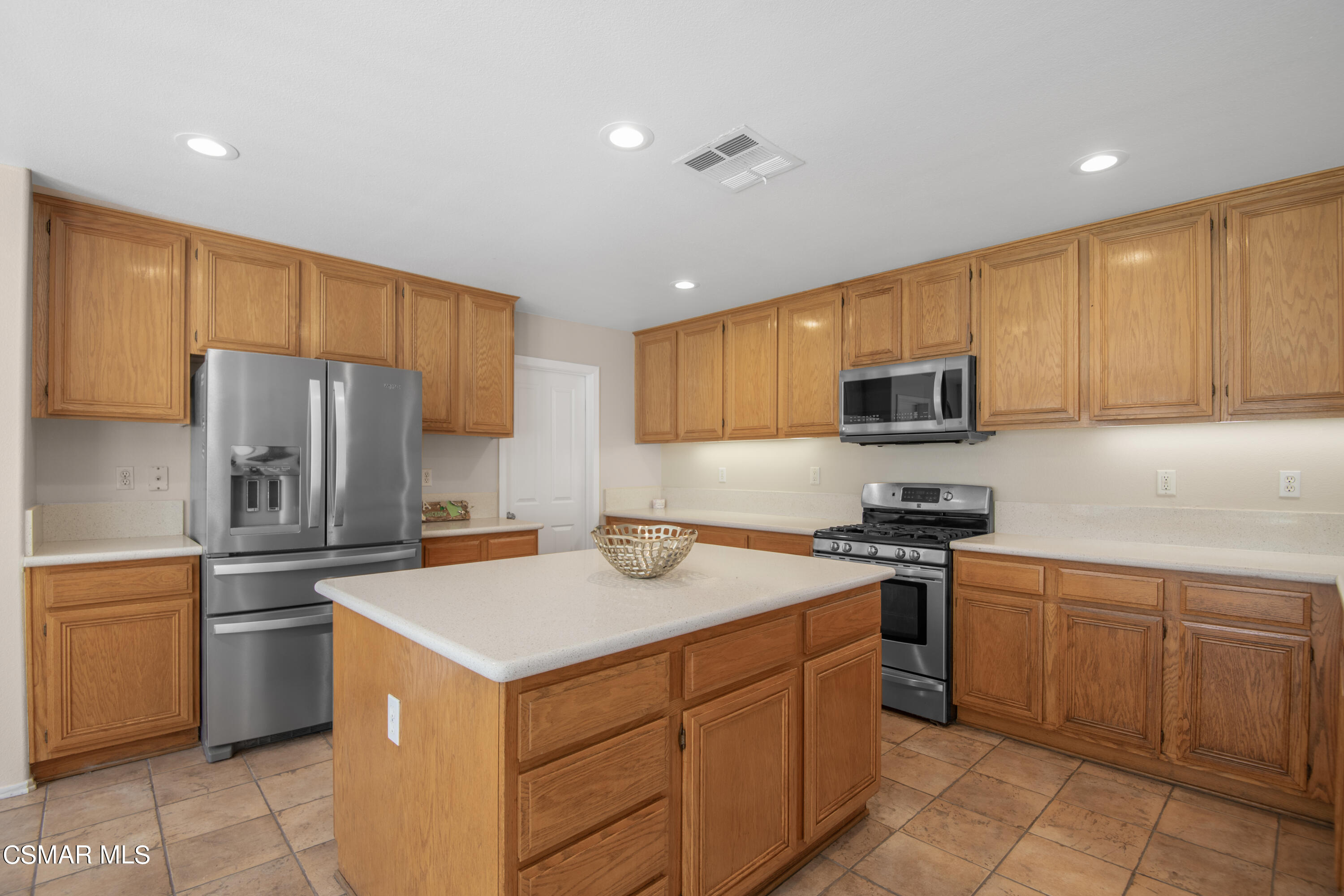32645 The Old Road Castaic, CA 91384 - Photo 11 of 32 a kitchen with a sink stove and refrigerator