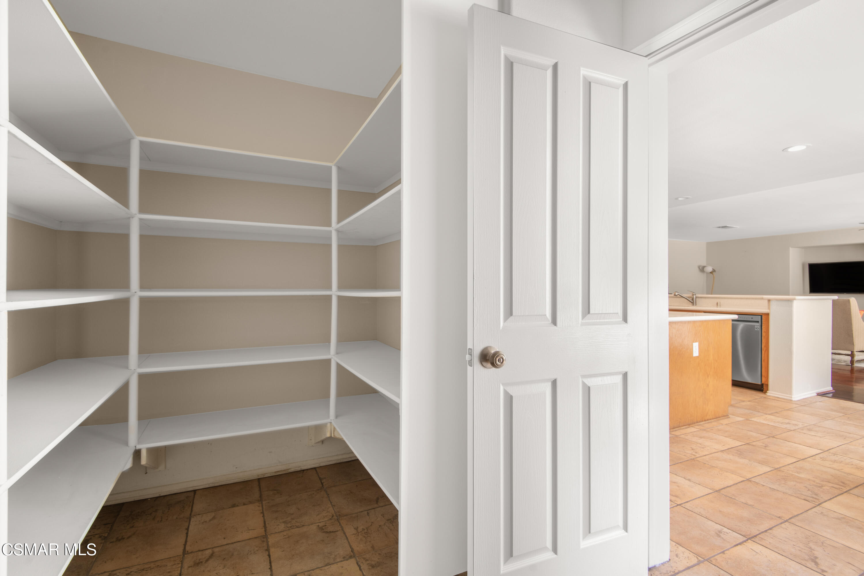 32645 The Old Road Castaic, CA 91384 - Photo 13 of 32 a view of a kitchen with white cabinets and entryway