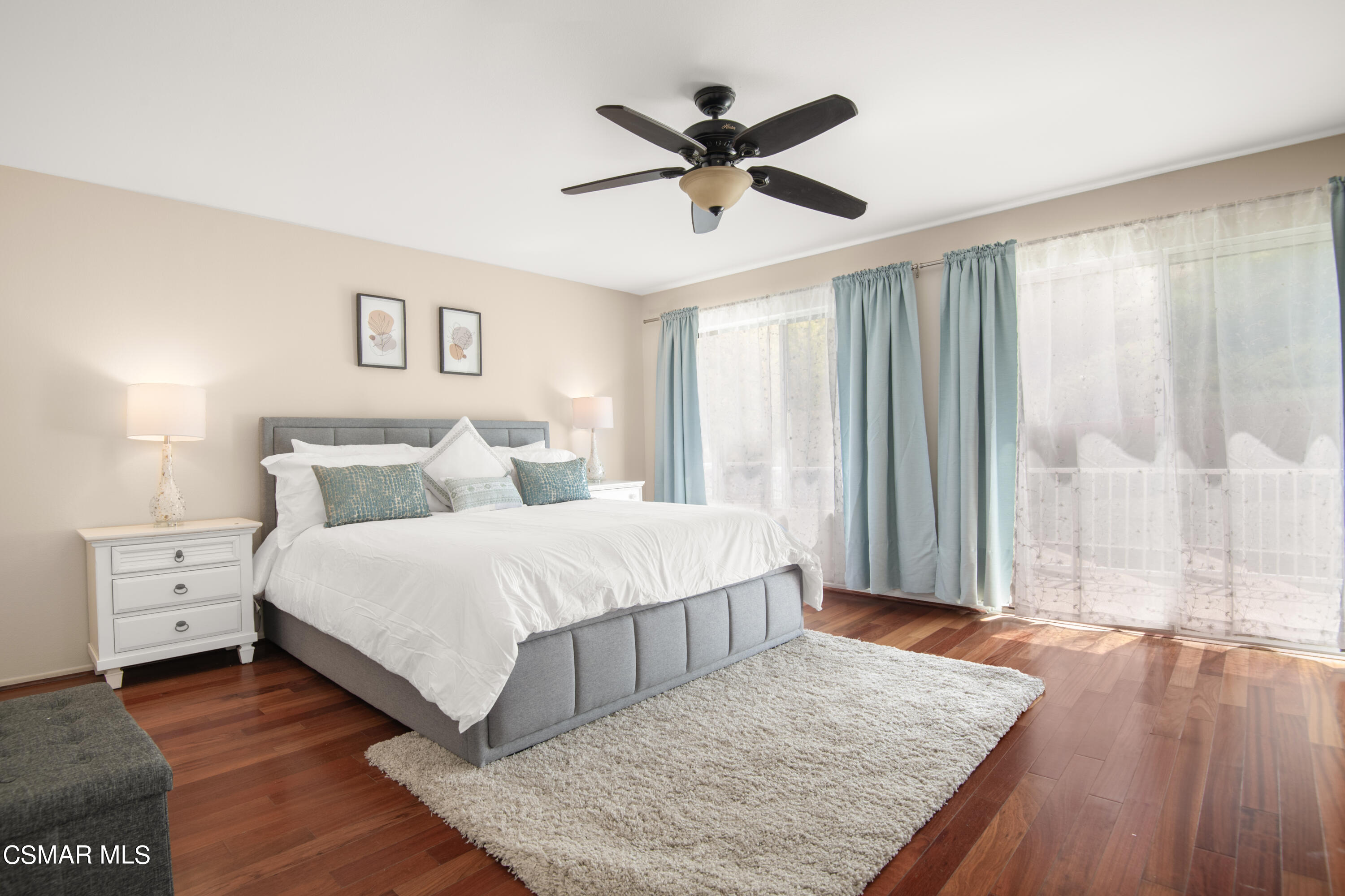 32645 The Old Road Castaic, CA 91384 - Photo 16 of 32 a bedroom with a large bed and a chandelier