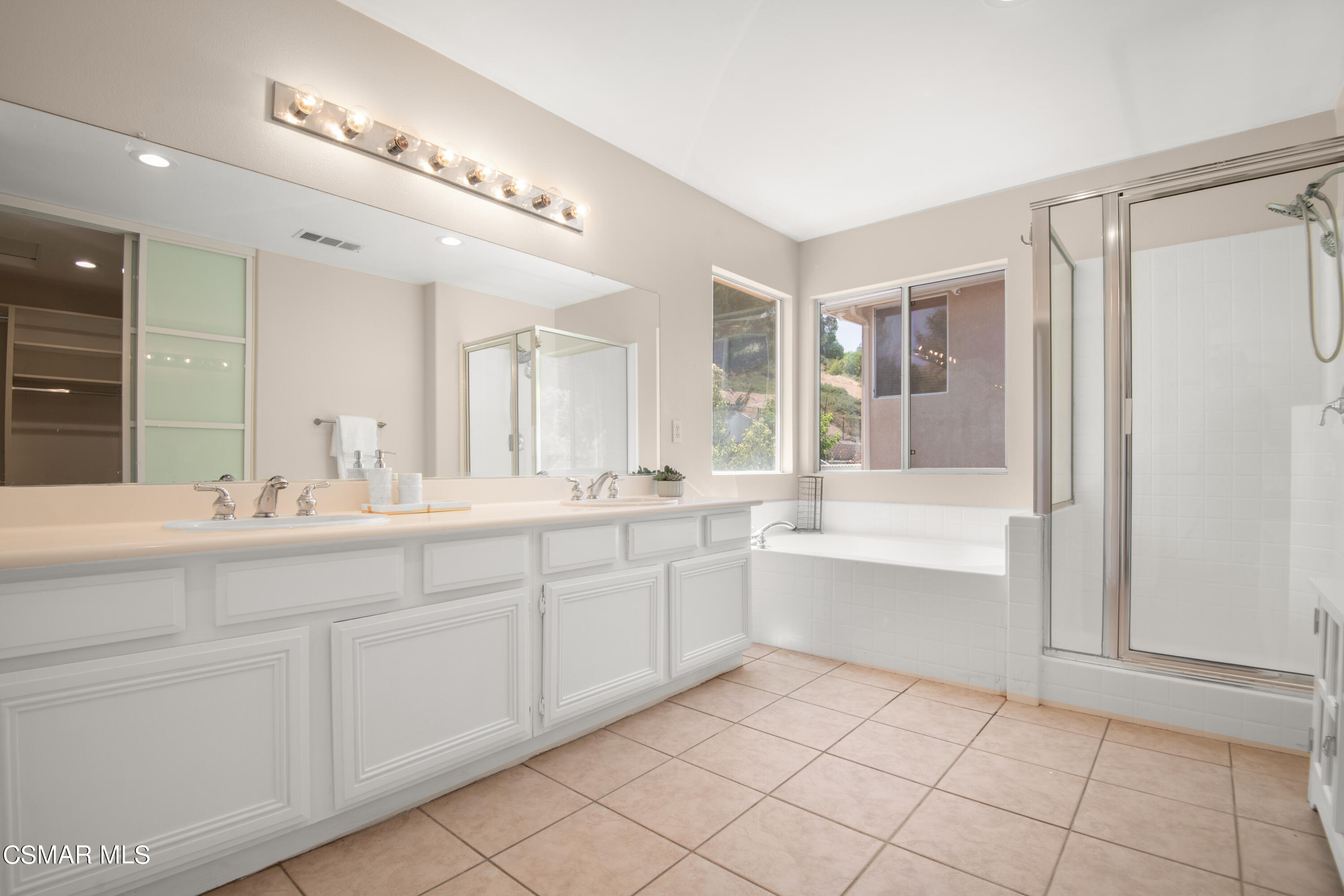32645 The Old Road Castaic, CA 91384 - Photo 19 of 32 a bathroom with a sink a mirror and a bathtub