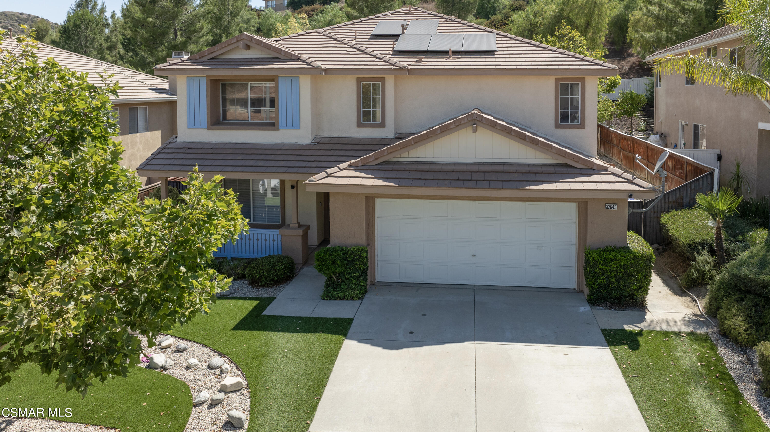 32645 The Old Road Castaic, CA 91384 - Photo 2 of 32 a front view of a house with a garden