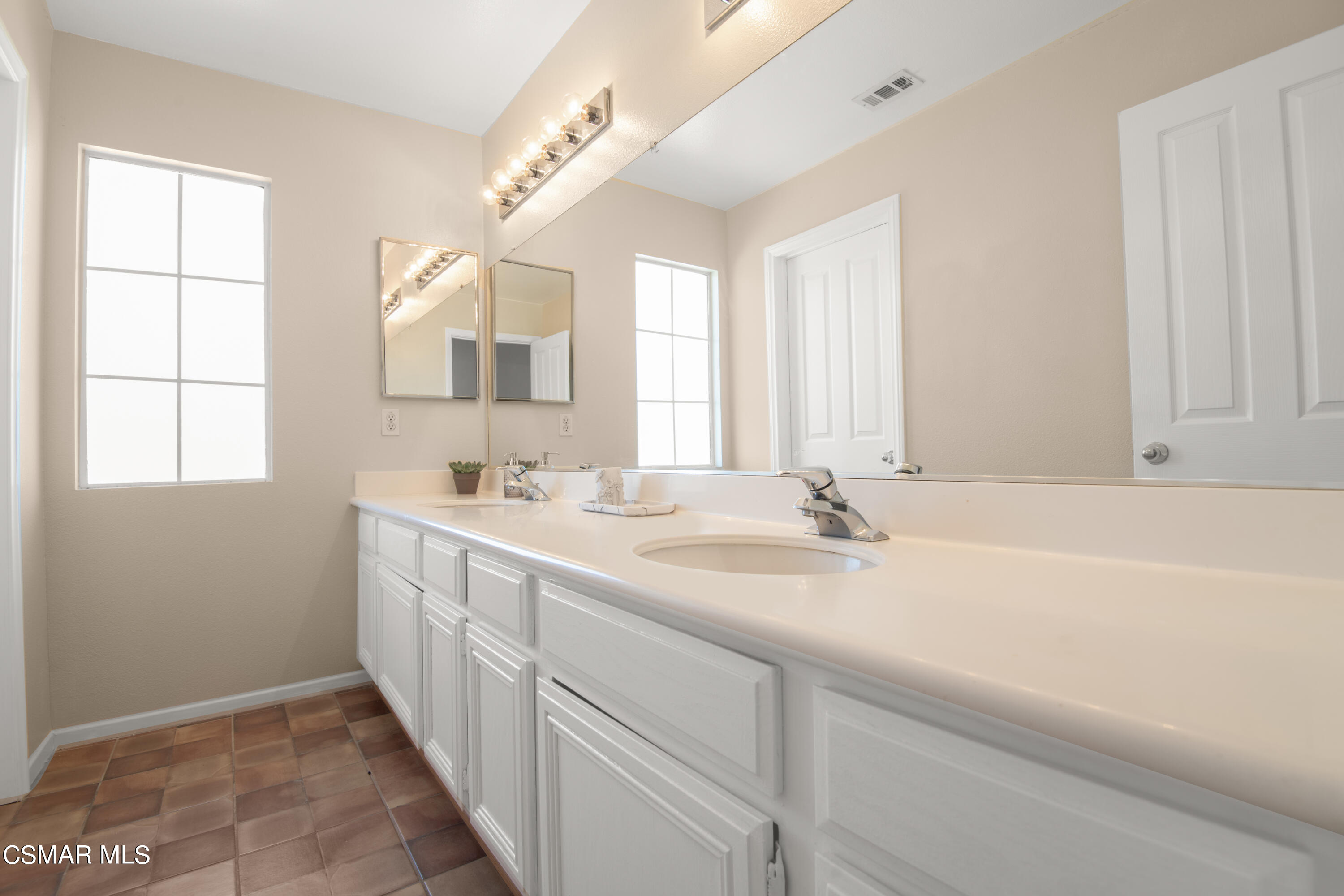 32645 The Old Road Castaic, CA 91384 - Photo 23 of 32 a bathroom with a bathtub a sink and a window