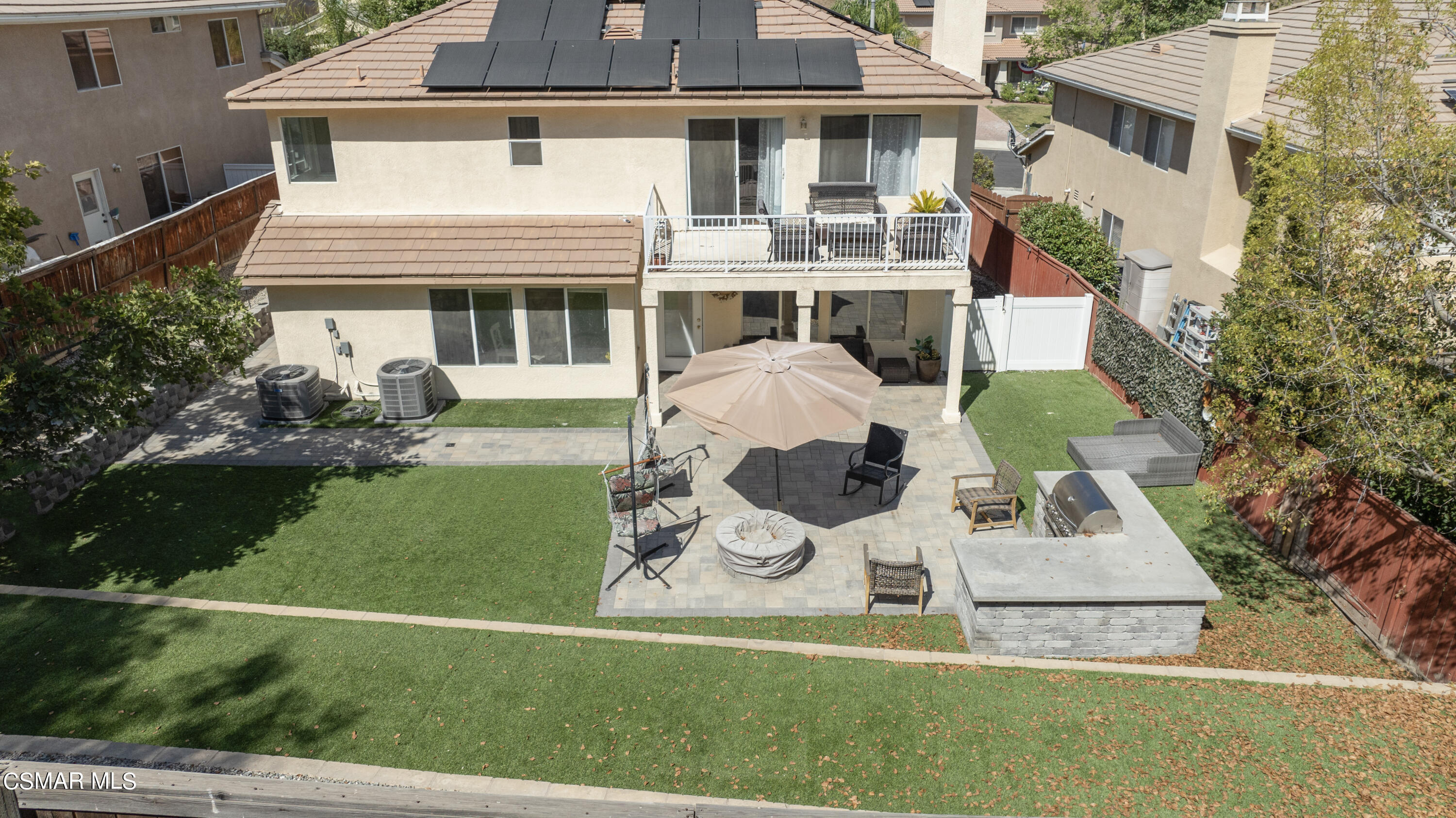 32645 The Old Road Castaic, CA 91384 - Photo 28 of 32 a view of a white house with a yard patio and a fire pit