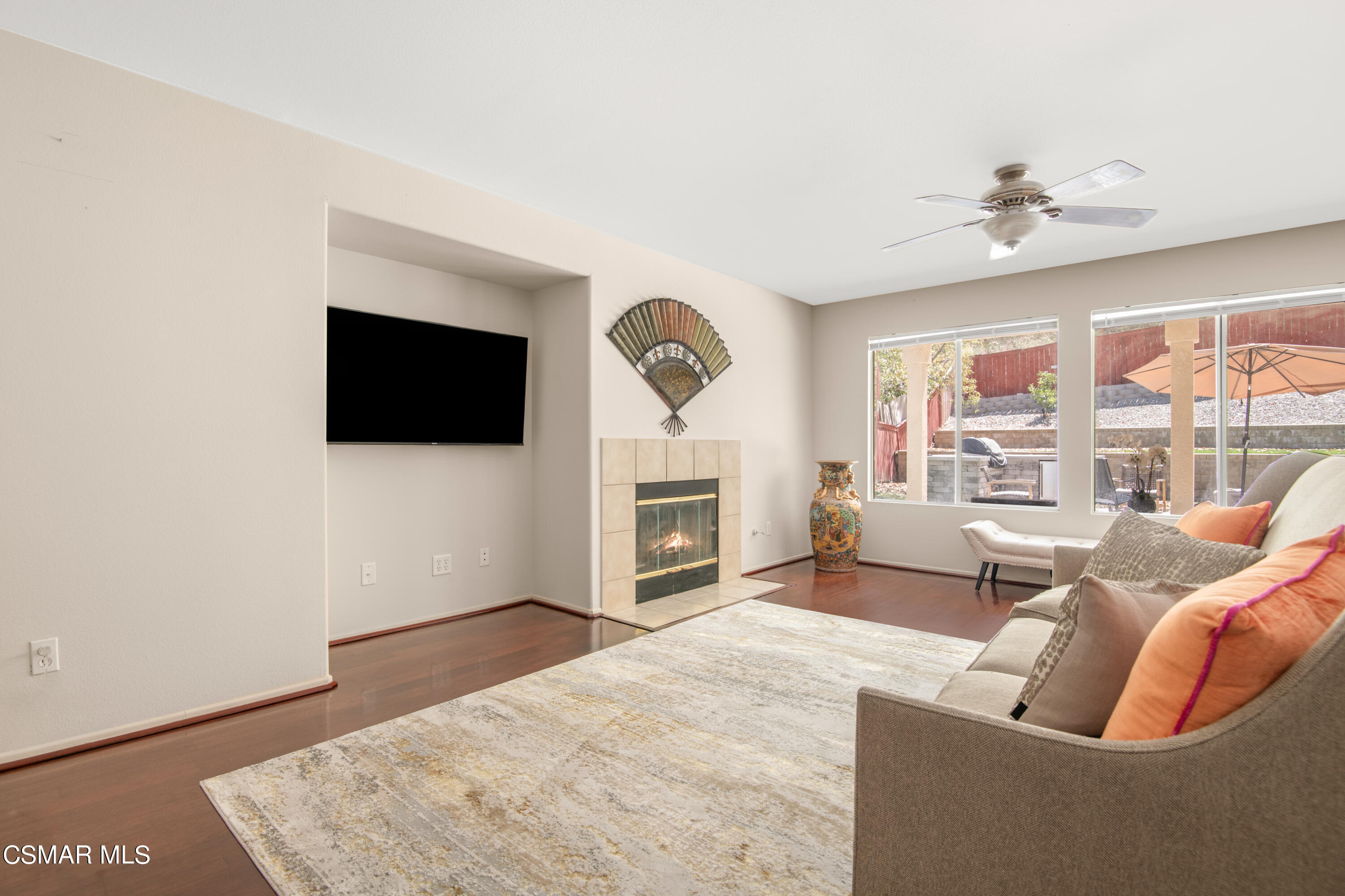 32645 The Old Road Castaic, CA 91384 - Photo 7 of 32 a living room with furniture a fireplace and a flat screen tv
