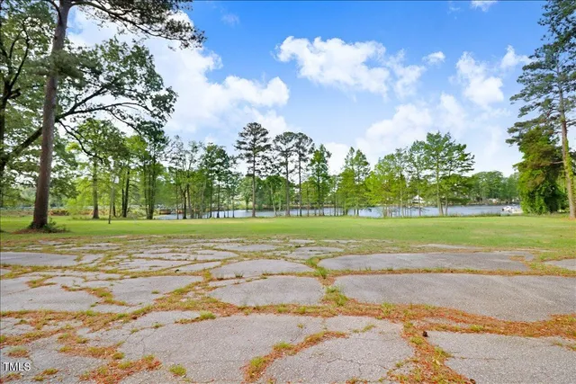 a view of outdoor space with deck and trees