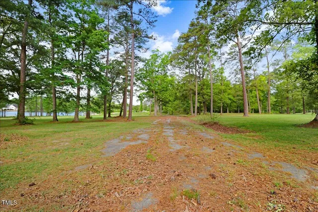 a view of outdoor space with deck and yard