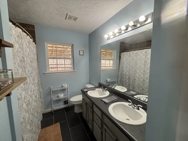 a bedroom with a bed and furniture