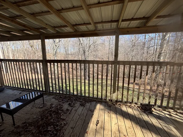 a view of outdoor space with wooden floor