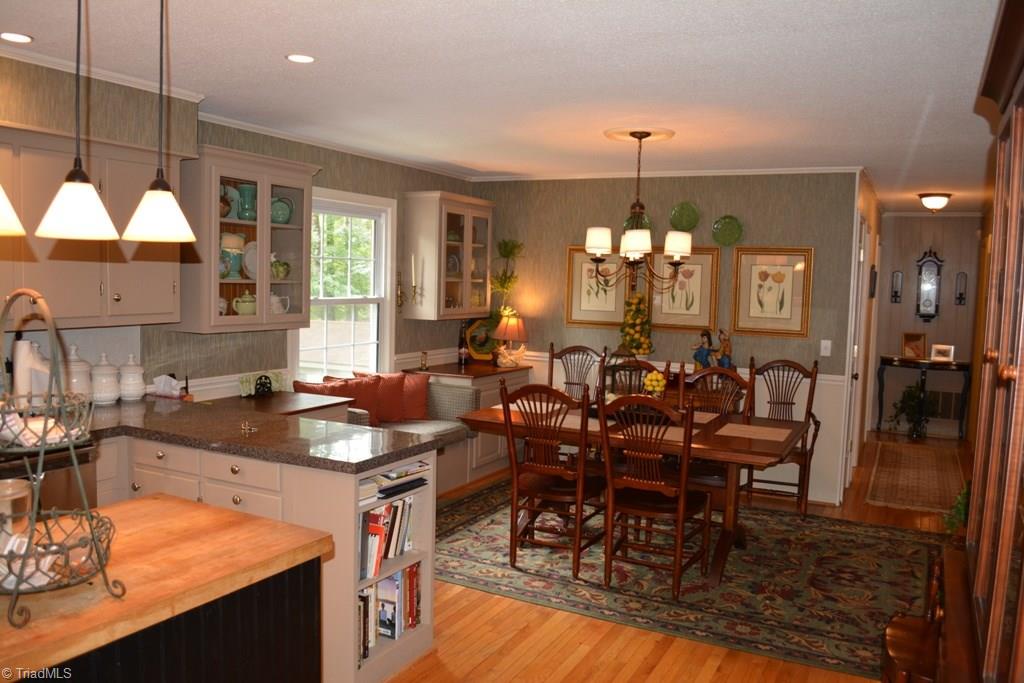 2582 Little Elkin Church Road Ronda, NC 28670 - Photo 2 of 30 Awesome kitchen / dining area. Hardwood floors, wainscot, updated lighting.