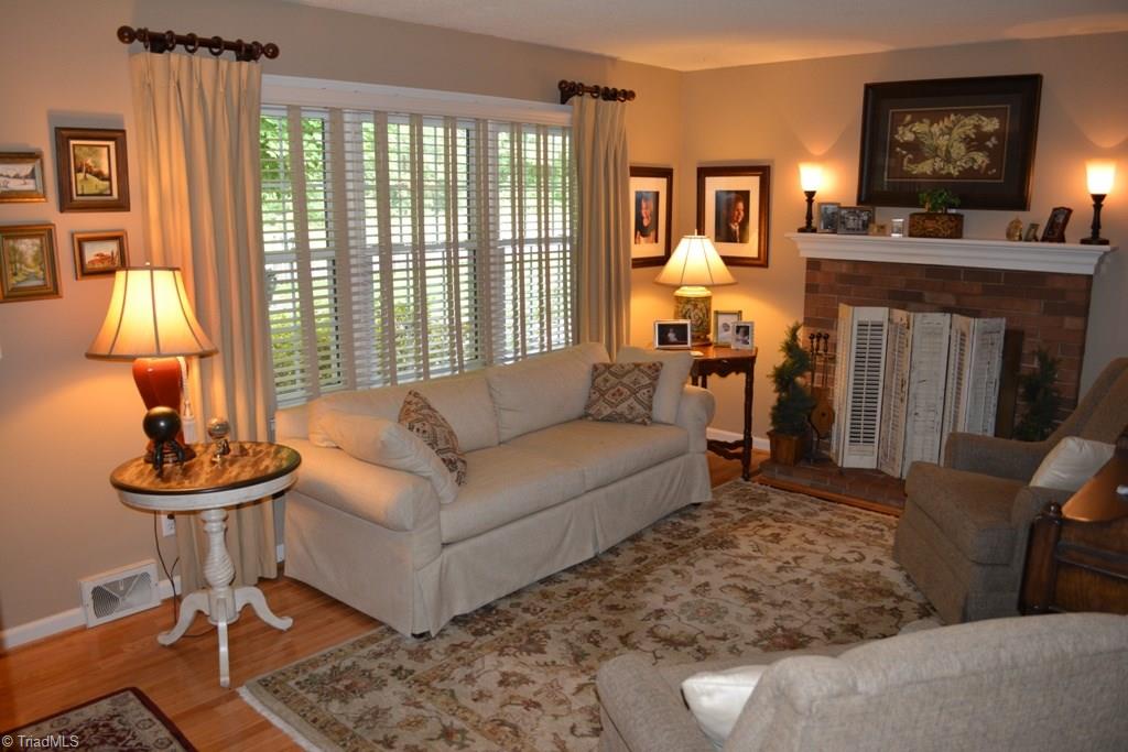 2582 Little Elkin Church Road Ronda, NC 28670 - Photo 11 of 30 Living room has hardwood flooring and wood burning fireplace