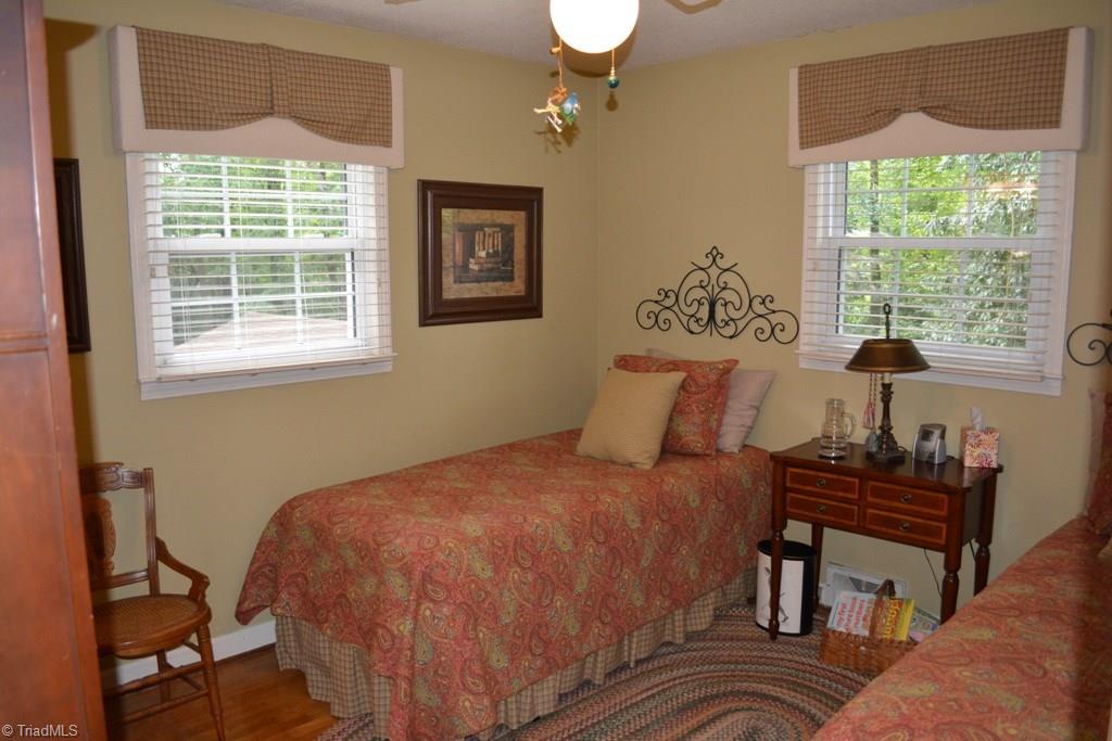 2582 Little Elkin Church Road Ronda, NC 28670 - Photo 19 of 30 Second bedroom with hardwood floors. Currently has 2 twin beds.
