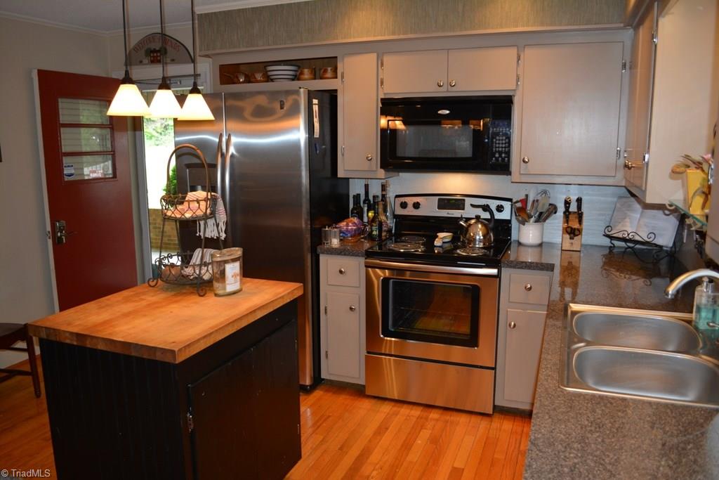 2582 Little Elkin Church Road Ronda, NC 28670 - Photo 3 of 30 Kitchen with center island, stainless appliances. Stove and dishwasher are new!