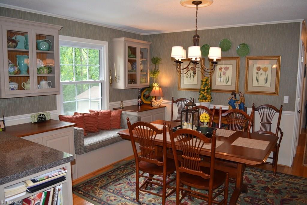 2582 Little Elkin Church Road Ronda, NC 28670 - Photo 4 of 30 Welcoming dining area with extra built in cabinets for storage, and wonderful window seat!