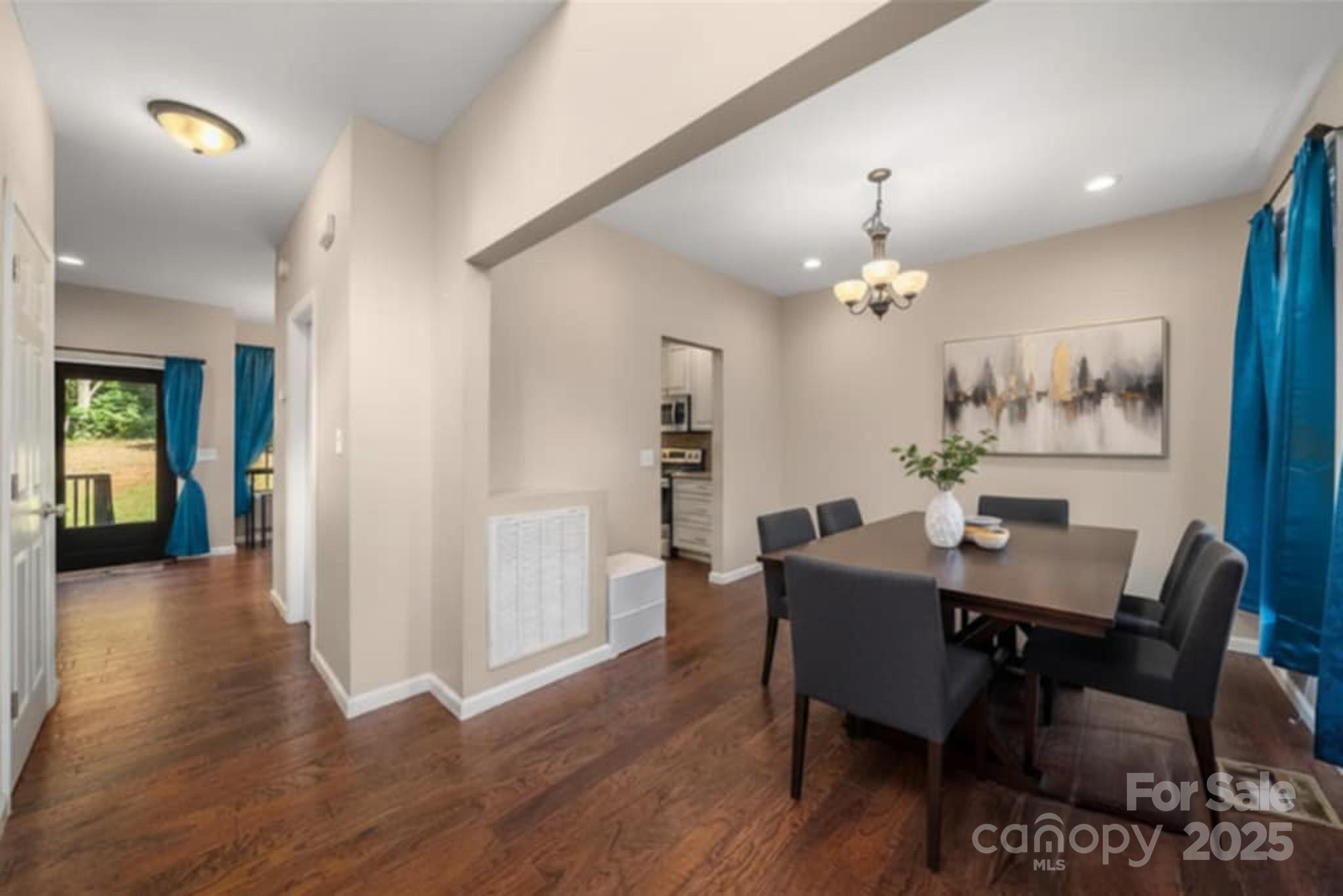 2341 Enola Road Morganton, NC 28655 - Photo 11 of 48 a view of a dining room with furniture and wooden floor