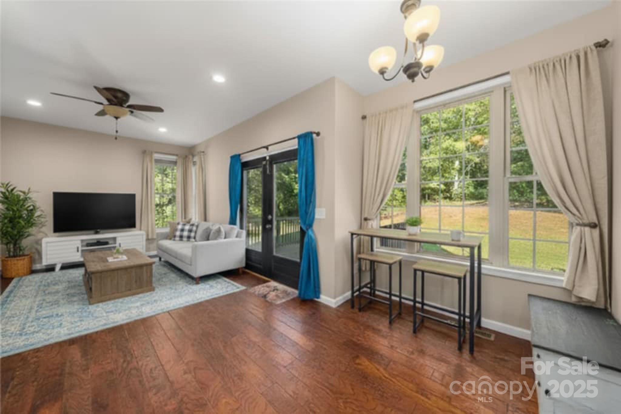 2341 Enola Road Morganton, NC 28655 - Photo 16 of 48 a living room with furniture and a flat screen tv