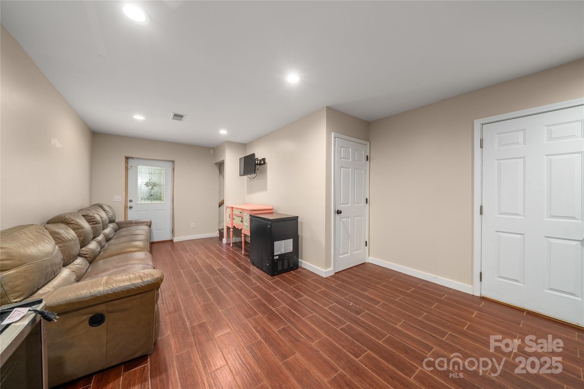 2341 Enola Road Morganton, NC 28655 - Photo 23 of 48 a living room with furniture and a wooden floor
