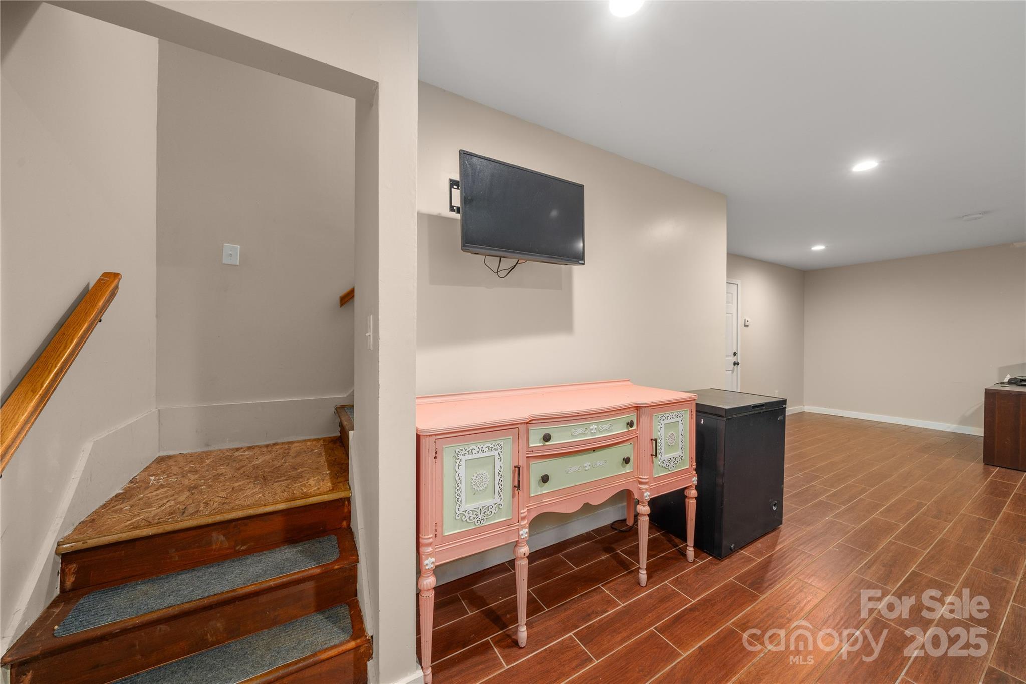 2341 Enola Road Morganton, NC 28655 - Photo 24 of 48 a room with furniture a flat screen tv and a table