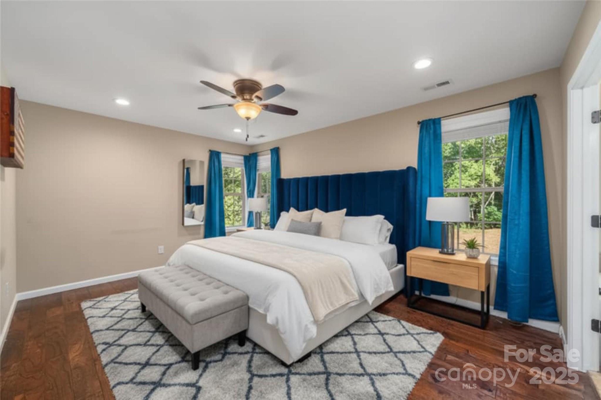 2341 Enola Road Morganton, NC 28655 - Photo 32 of 48 a bedroom with a bed and a chandelier