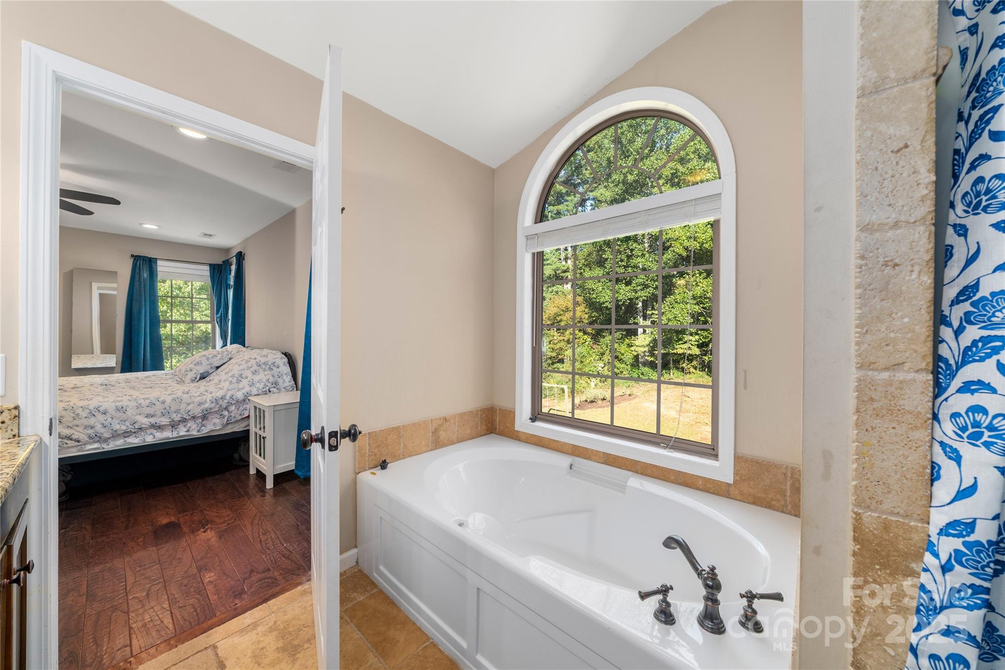 2341 Enola Road Morganton, NC 28655 - Photo 36 of 48 a bath room with a tub and a large window