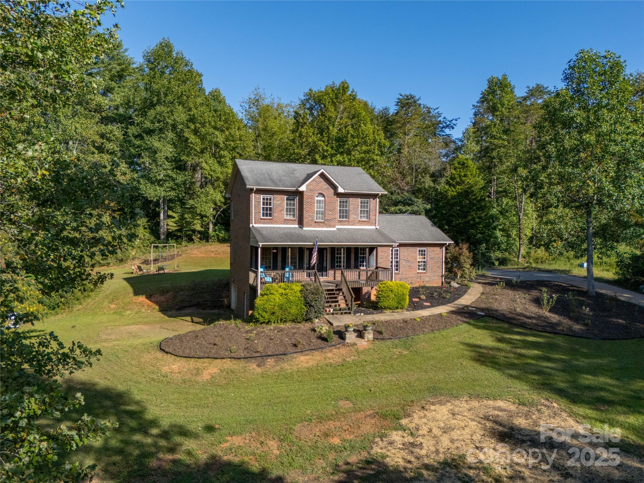 2341 Enola Road Morganton, NC 28655 - Photo 39 of 48 a view of a house with a big yard and large trees