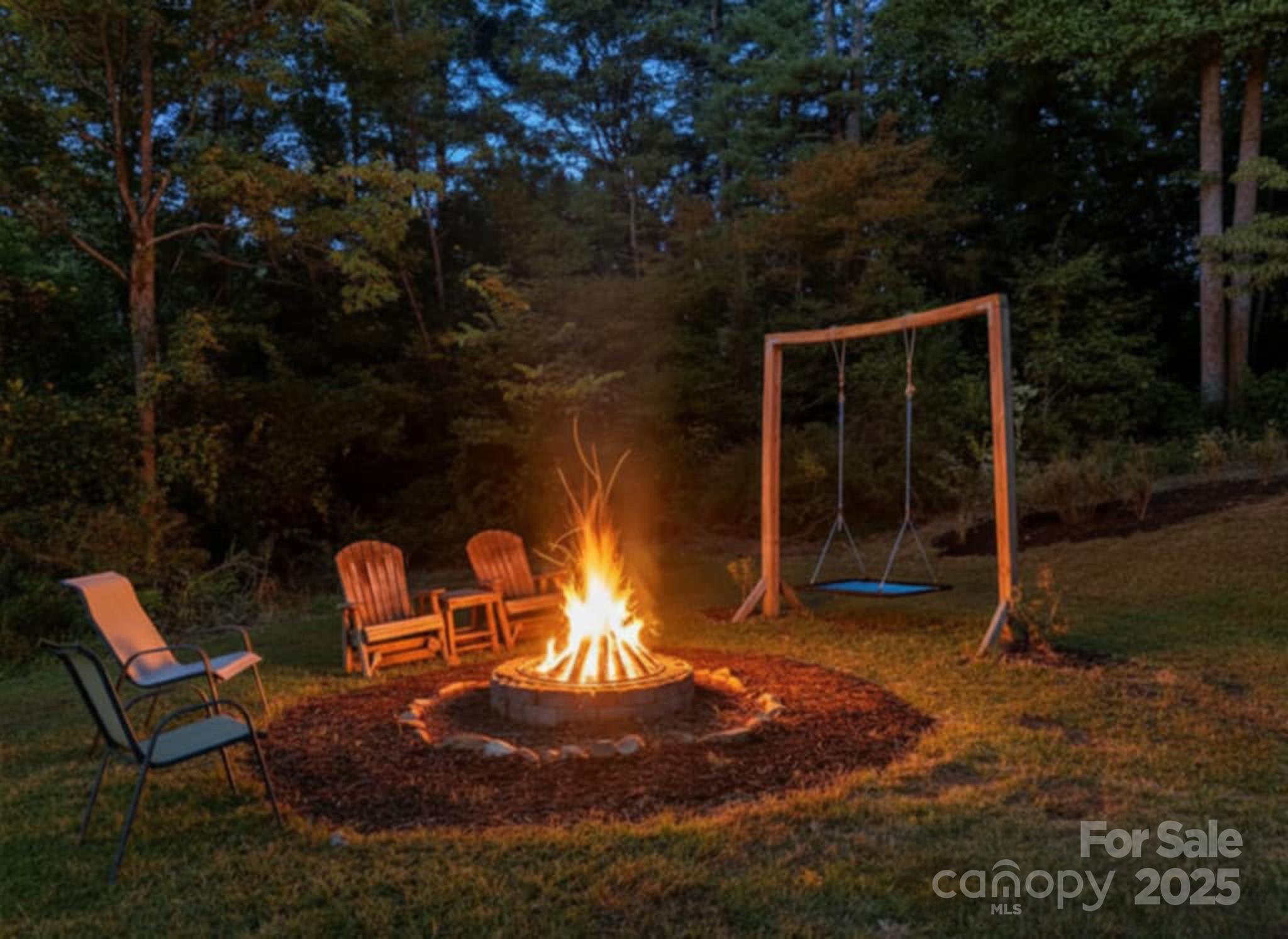 2341 Enola Road Morganton, NC 28655 - Photo 43 of 48 a backyard of a house with table and chairs