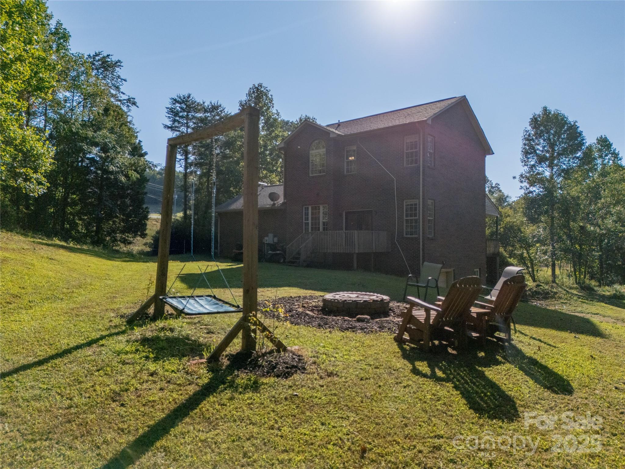 2341 Enola Road Morganton, NC 28655 - Photo 44 of 48 a backyard of a house with table and chairs