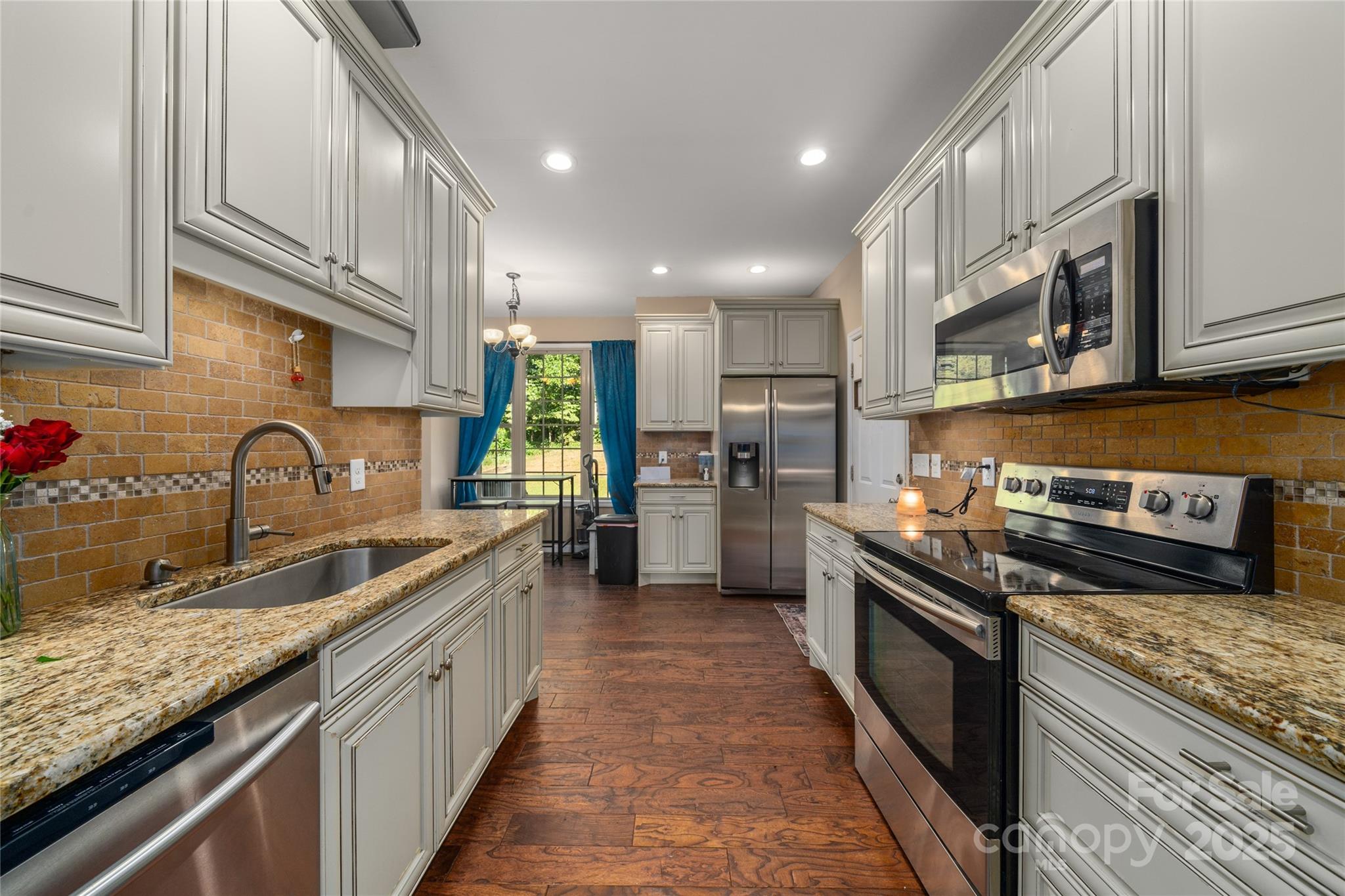 2341 Enola Road Morganton, NC 28655 - Photo 10 of 48 a kitchen with stainless steel appliances granite countertop a sink and stove