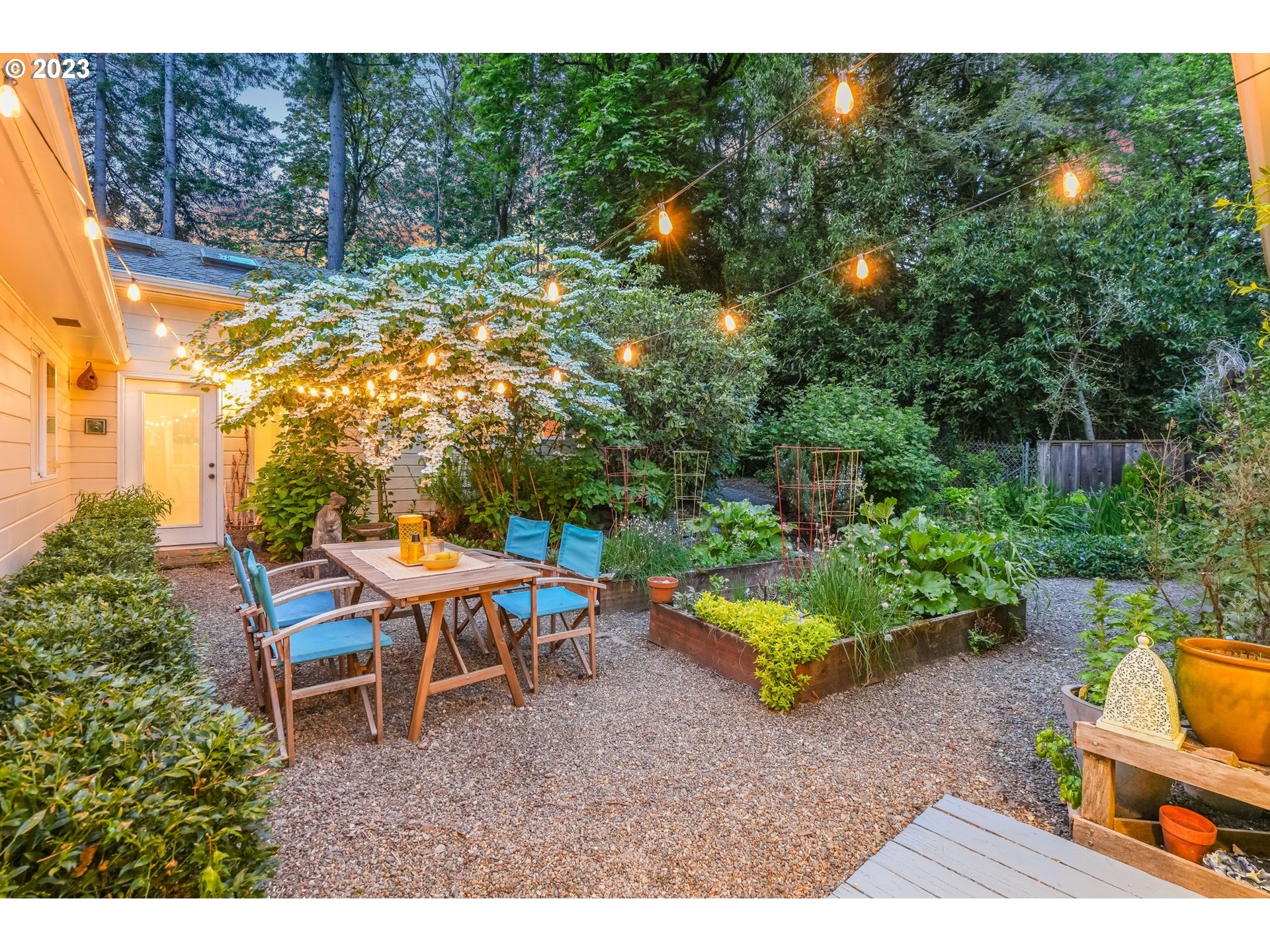 644 South Palatine Hill Road Portland, OR 97219 - Photo 11 of 46 a backyard of a house with a yard and outdoor seating