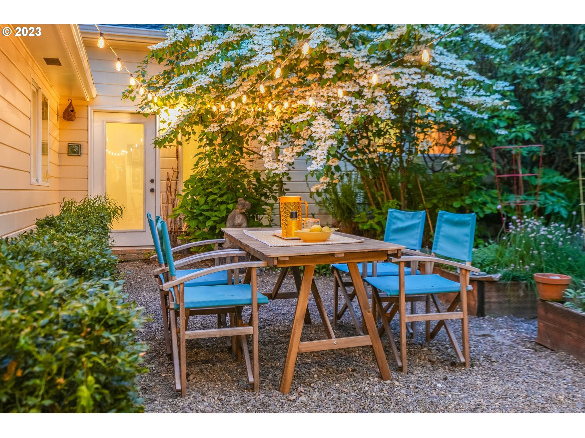 644 South Palatine Hill Road Portland, OR 97219 - Photo 12 of 46 a backyard of a house with table and chairs