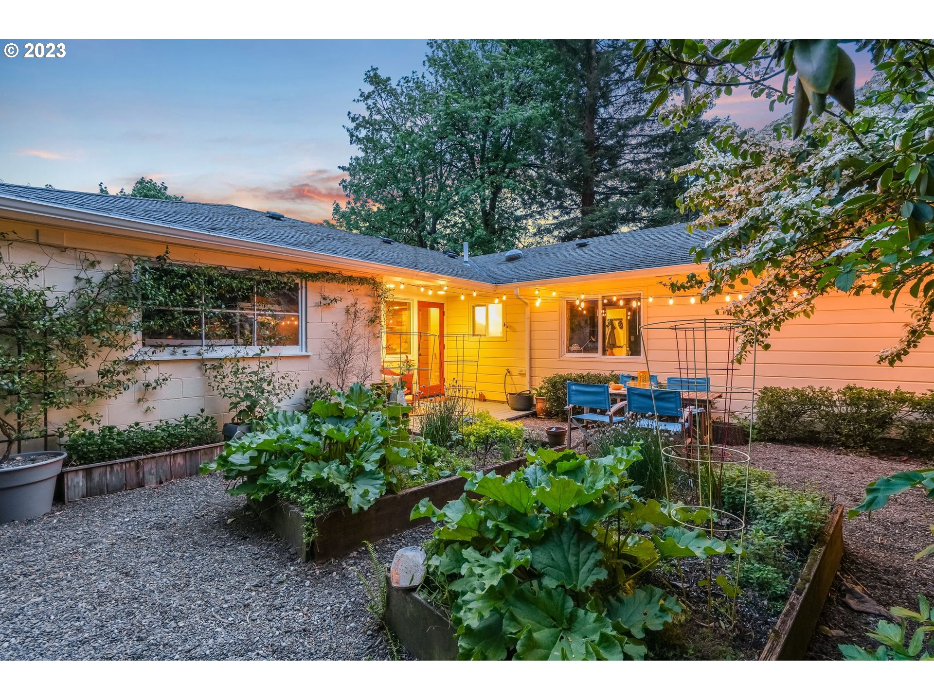644 South Palatine Hill Road Portland, OR 97219 - Photo 13 of 46 a backyard of a house with a yard and outdoor seating