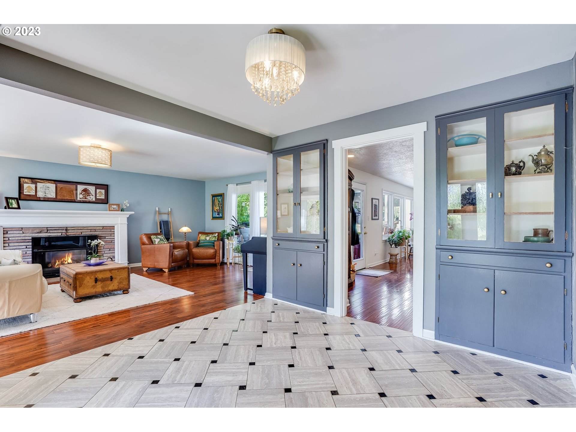 644 South Palatine Hill Road Portland, OR 97219 - Photo 15 of 46 a living room with furniture a fireplace and a large window