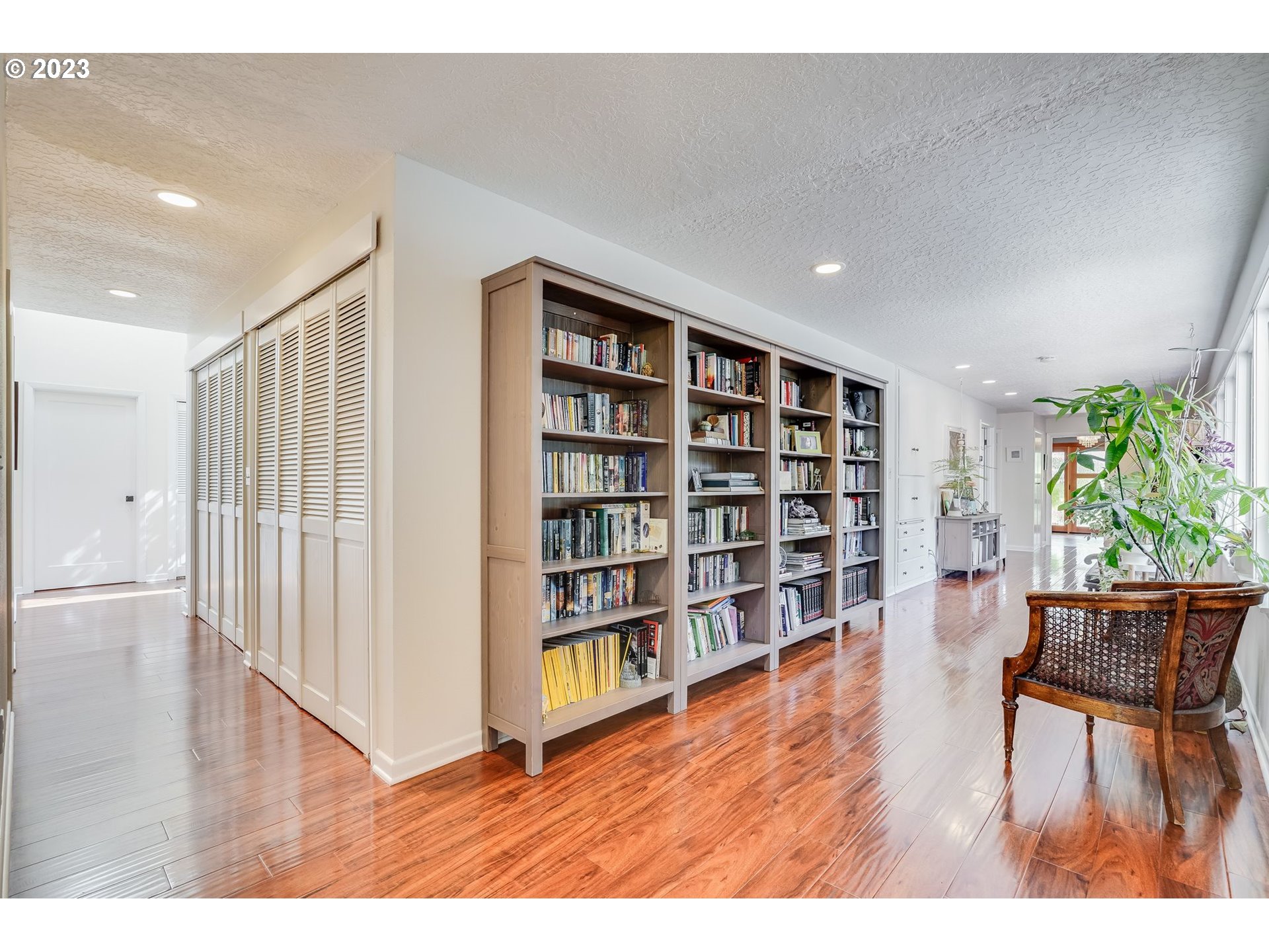 644 South Palatine Hill Road Portland, OR 97219 - Photo 17 of 46 a living room with furniture and a book shelf