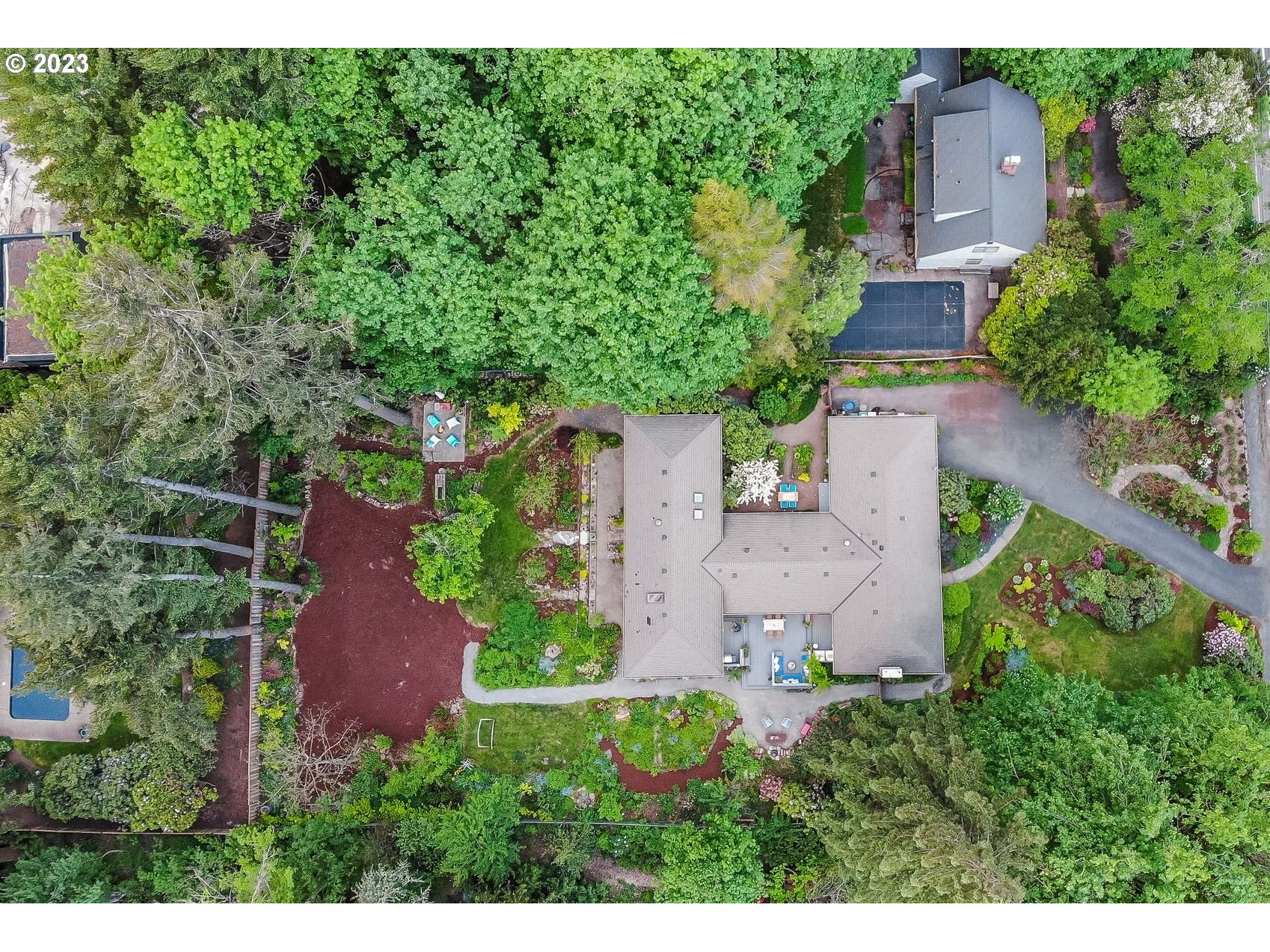 644 South Palatine Hill Road Portland, OR 97219 - Photo 2 of 46 an aerial view of a house with a yard