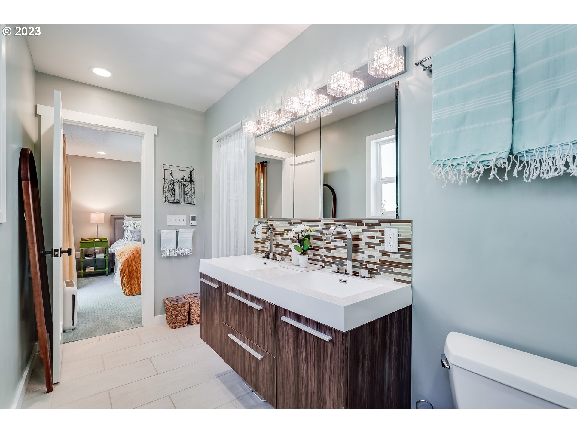644 South Palatine Hill Road Portland, OR 97219 - Photo 21 of 46 a bathroom with a sink vanity mirror and a toilet