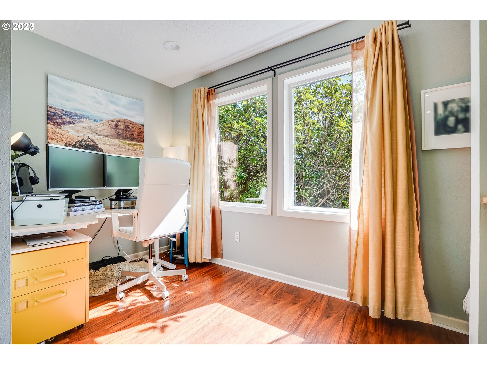 644 South Palatine Hill Road Portland, OR 97219 - Photo 22 of 46 a view of a workspace with furniture and a flat screen tv