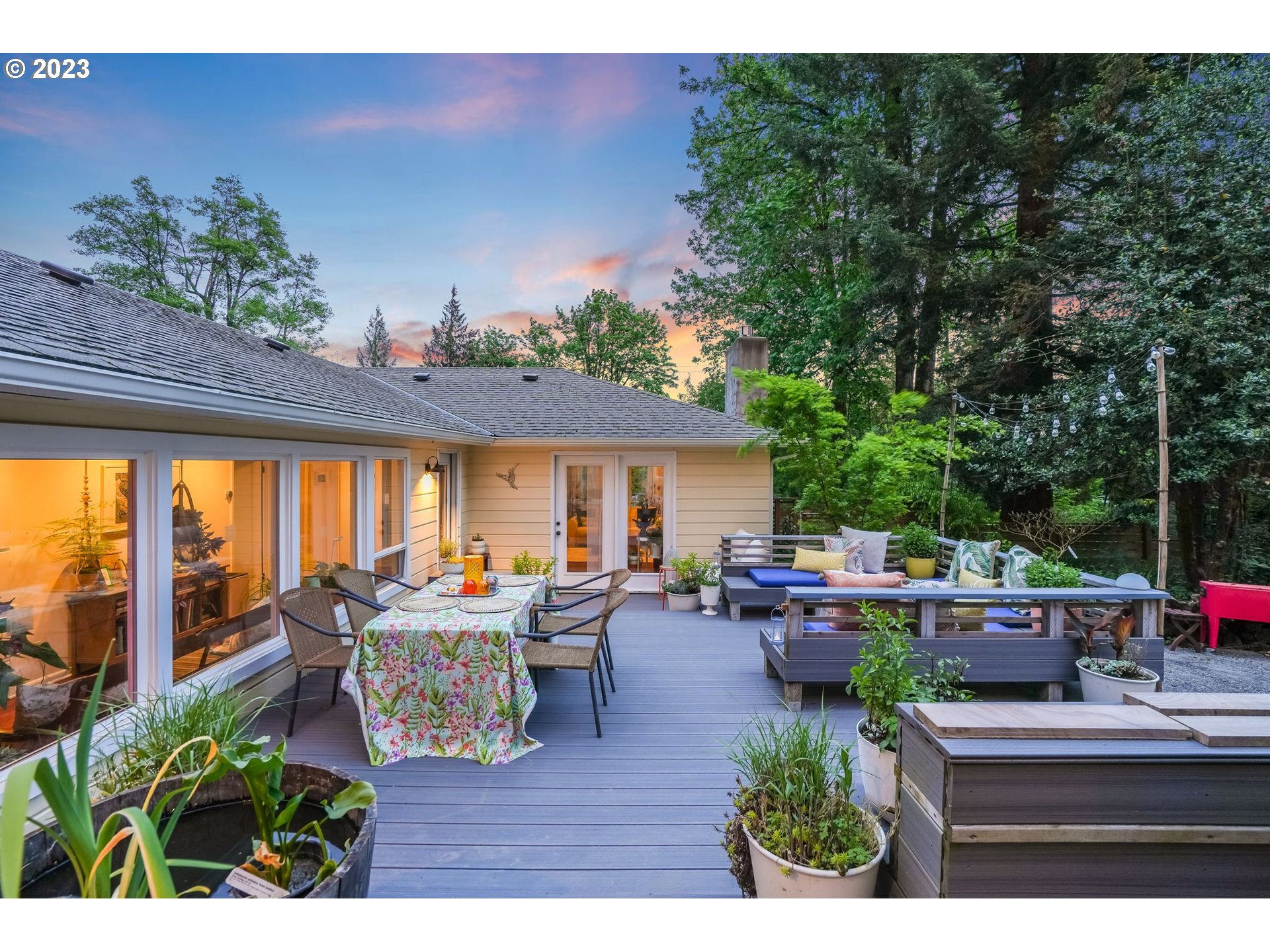 644 South Palatine Hill Road Portland, OR 97219 - Photo 24 of 46 a view of a patio with couches table and chairs and potted plants