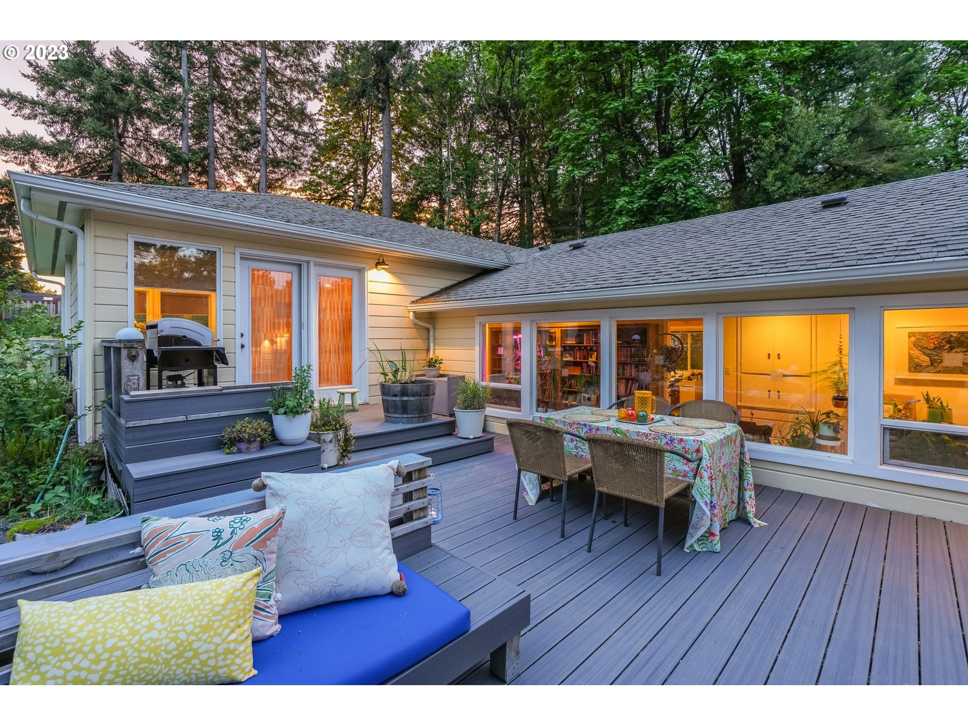 644 South Palatine Hill Road Portland, OR 97219 - Photo 27 of 46 a view of a patio with table and chairs potted plants with wooden floor