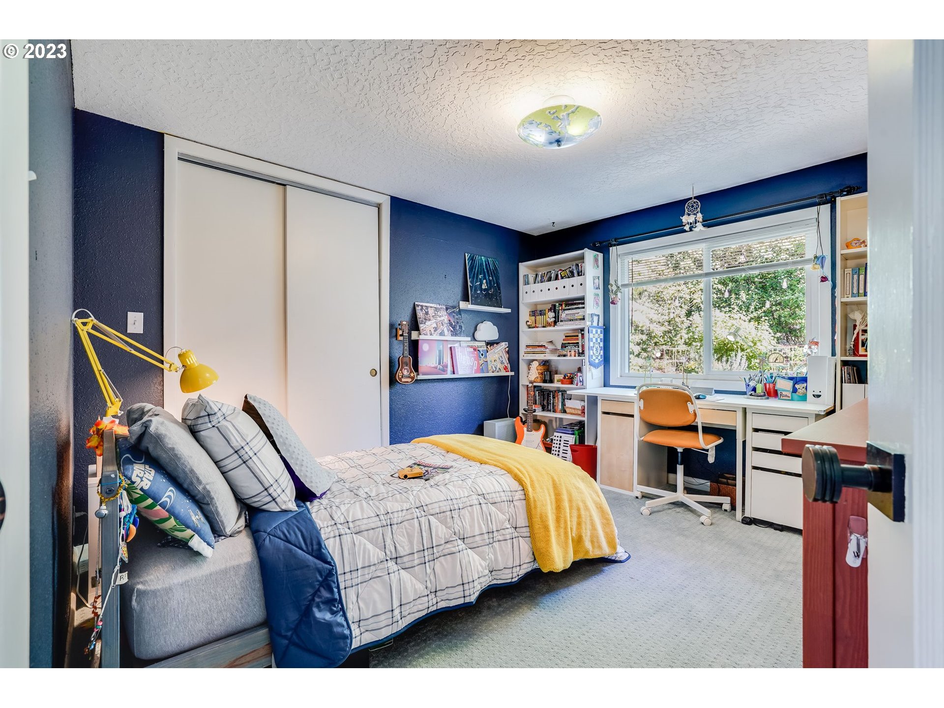 644 South Palatine Hill Road Portland, OR 97219 - Photo 29 of 46 a bedroom with a bed and large windows