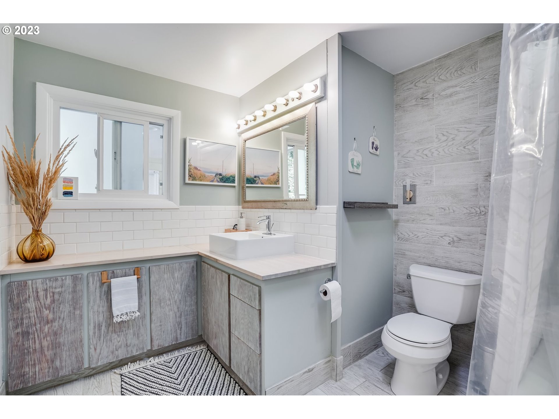 644 South Palatine Hill Road Portland, OR 97219 - Photo 30 of 46 a bathroom with a sink a toilet and mirror