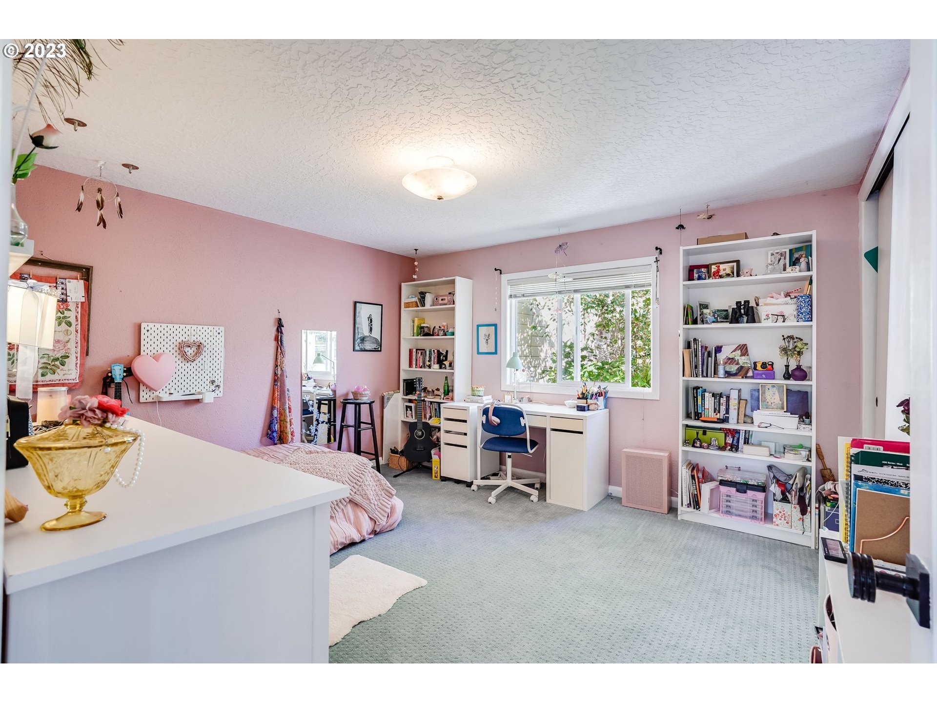 644 South Palatine Hill Road Portland, OR 97219 - Photo 31 of 46 a living room with furniture and a book shelf