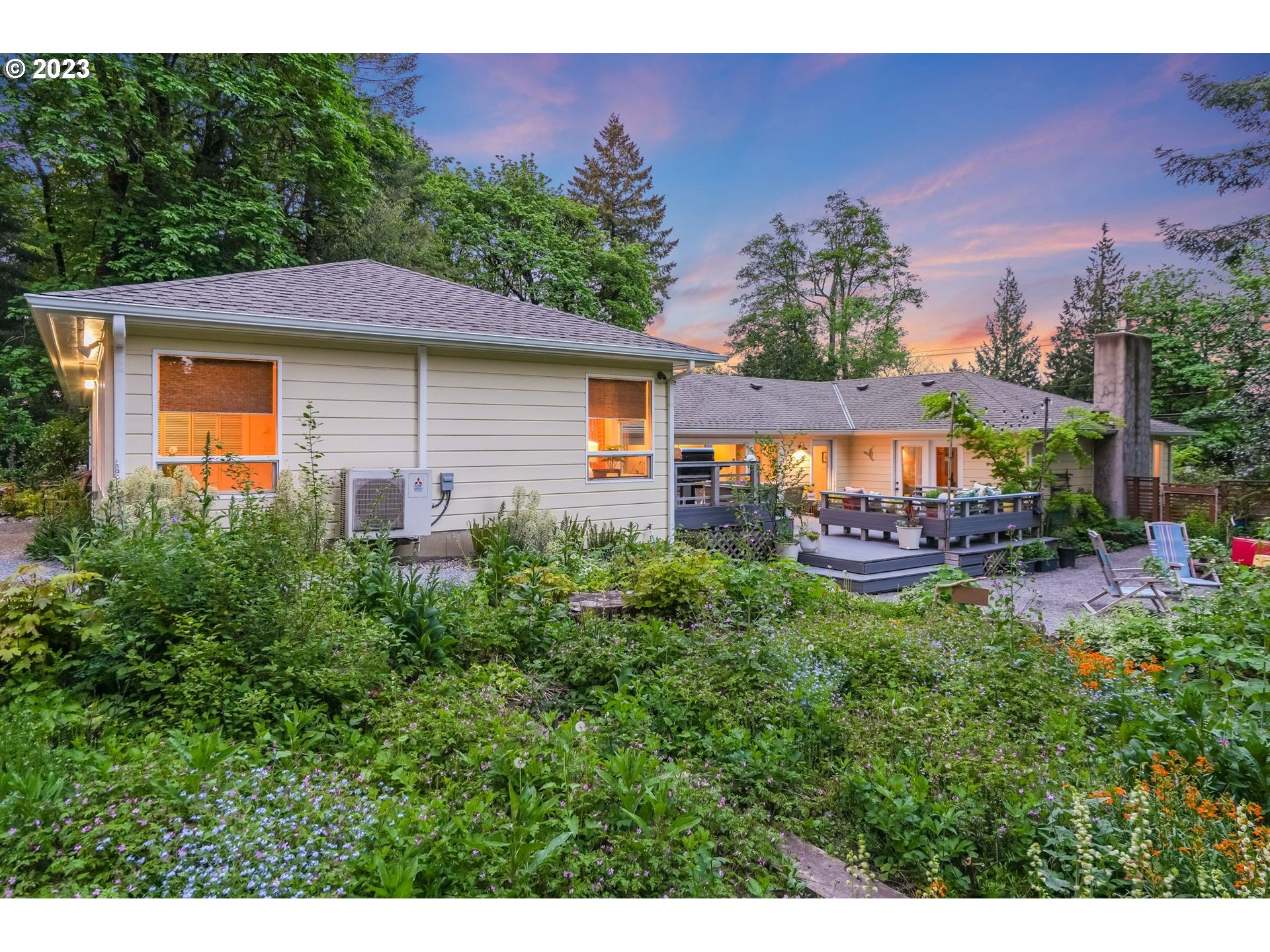 644 South Palatine Hill Road Portland, OR 97219 - Photo 37 of 46 a backyard of a house with table and chairs