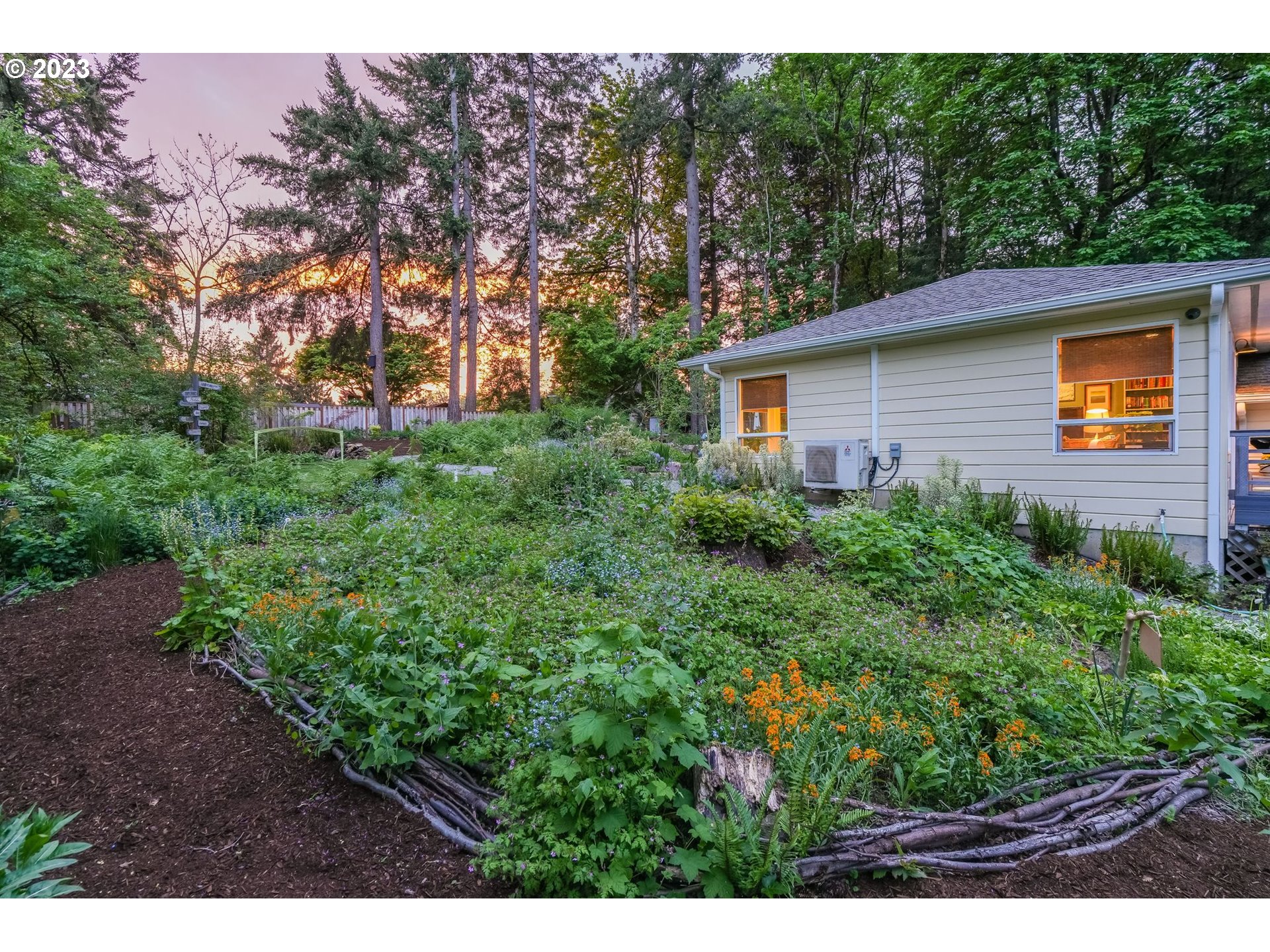 644 South Palatine Hill Road Portland, OR 97219 - Photo 38 of 46 a view of a backyard with plants and large trees