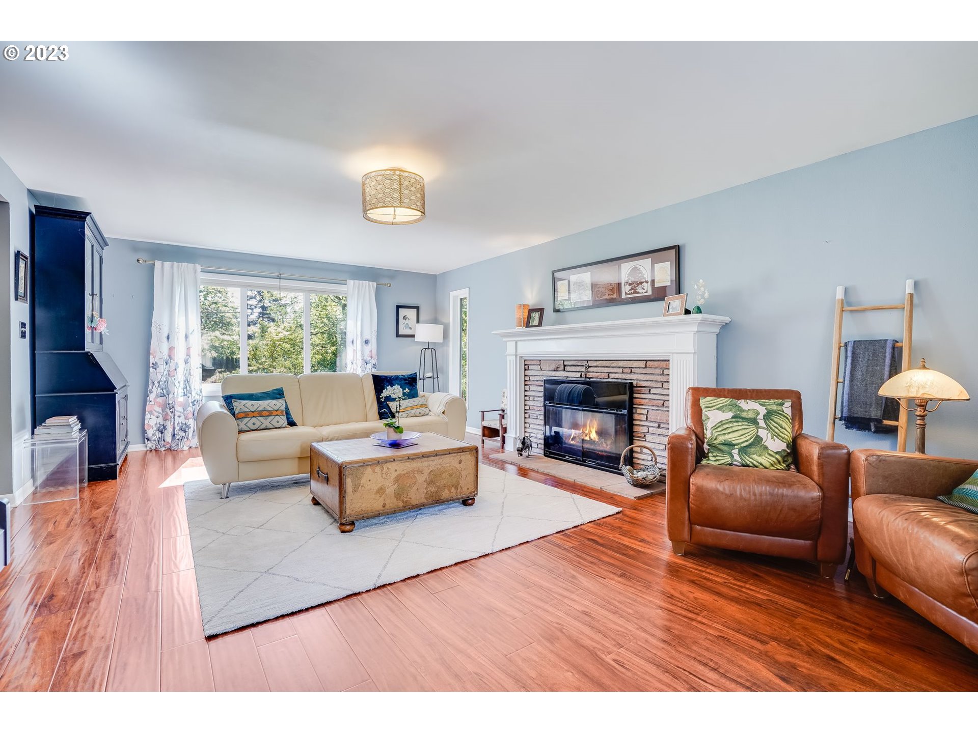 644 South Palatine Hill Road Portland, OR 97219 - Photo 5 of 46 a living room with furniture and a fireplace