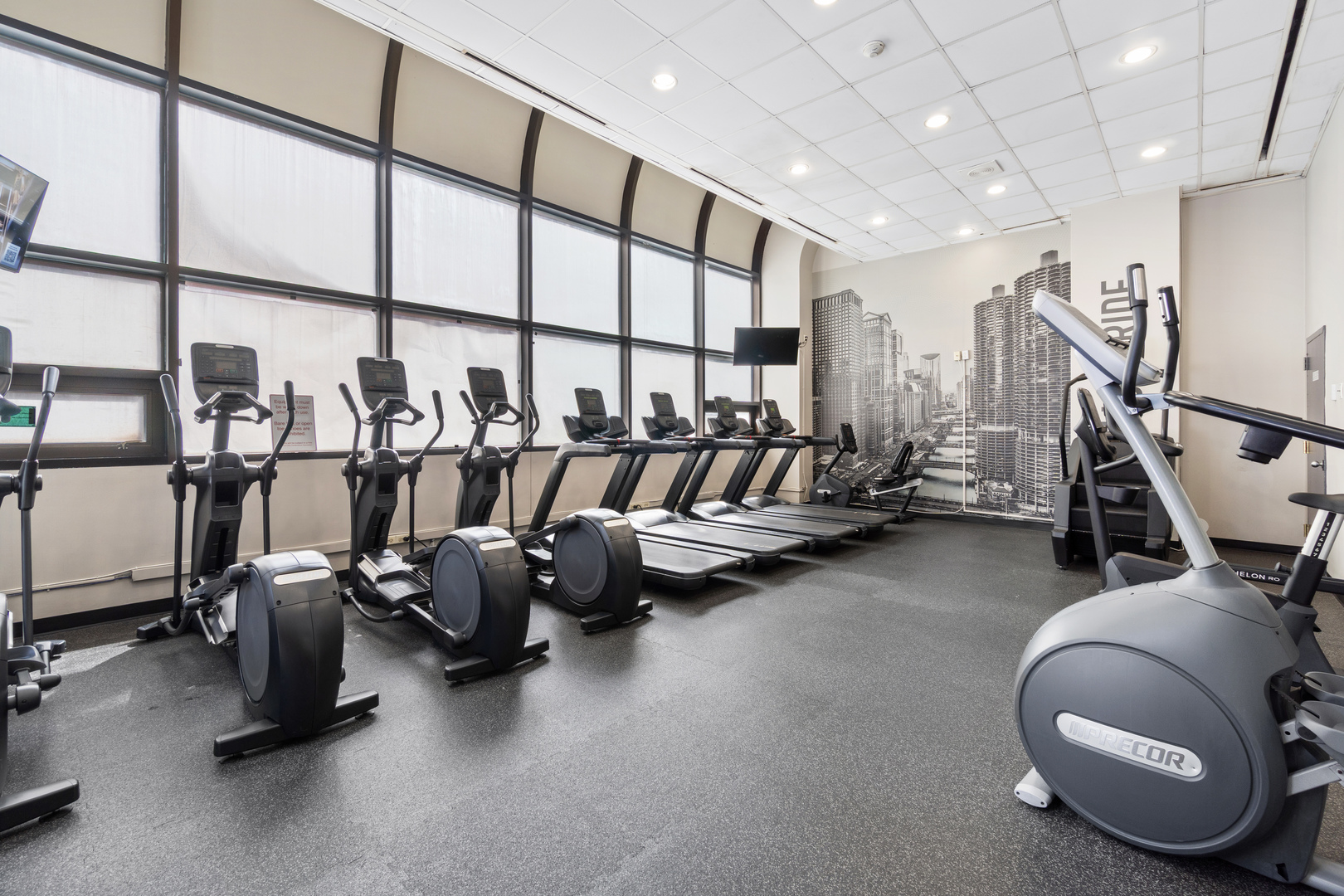211 East Ohio Street, Unit 2806 Chicago, IL 60611 - Photo 15 of 16 a view of a room with gym equipment