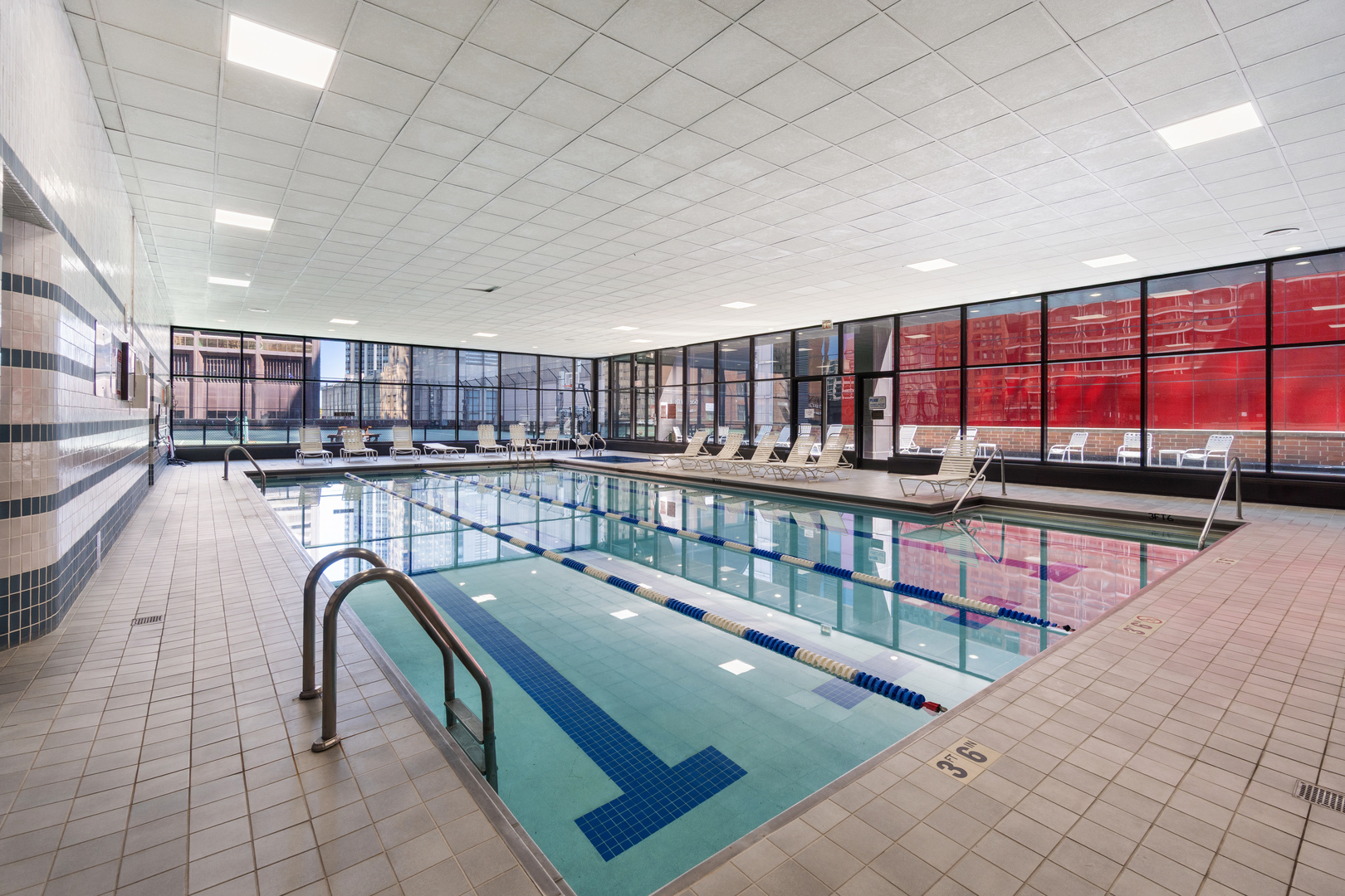 211 East Ohio Street, Unit 2806 Chicago, IL 60611 - Photo 16 of 16 a locker room with lots of furniture and white walls