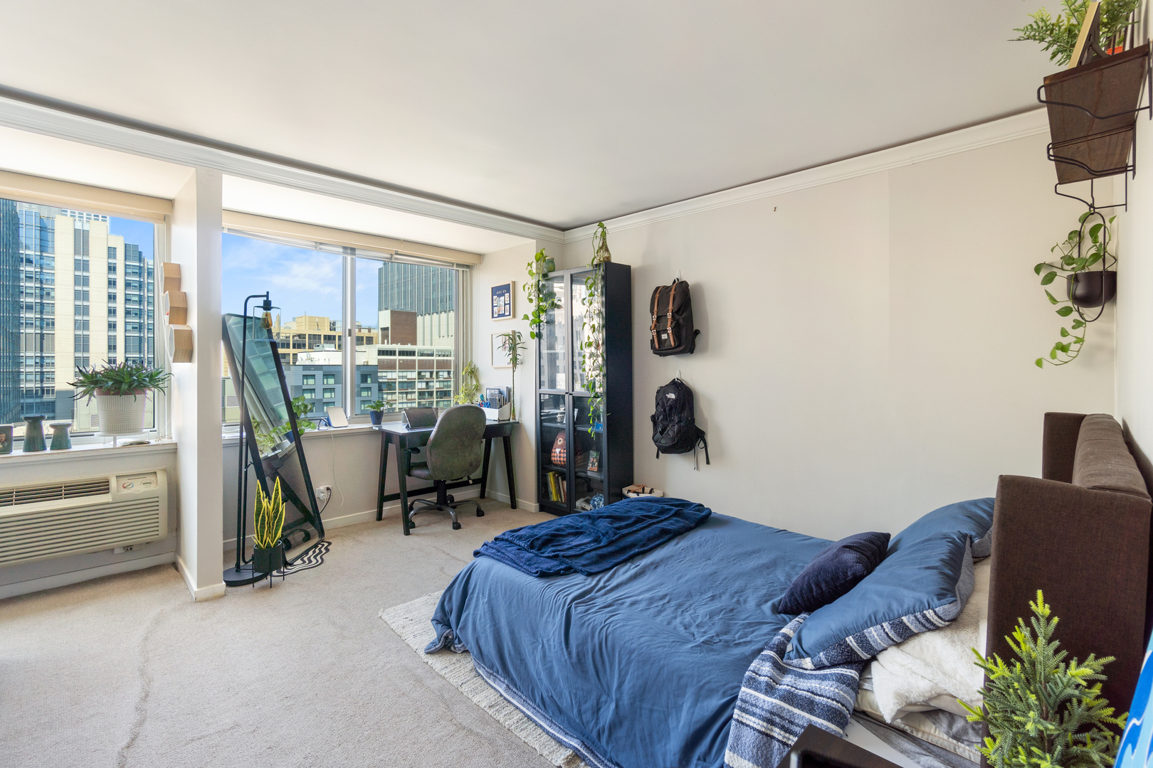 211 East Ohio Street, Unit 2806 Chicago, IL 60611 - Photo 5 of 16 a bedroom with a bed and a large window